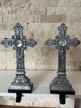 Silver mantle crosses with black hanger (set of 2).